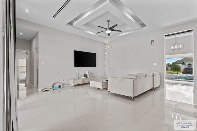 5483 Lovers Ln, Brownsville, TX 78526 - tiled living room with a raised ceiling and ceiling fan