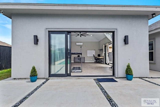 5483 Lovers Ln, Brownsville, TX 78526 - doorway to property with stucco siding and a patio