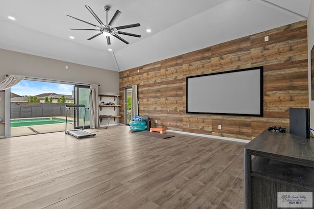 5483 Lovers Ln, Brownsville, TX 78526 - cinema with wood walls, ceiling fan, recessed lighting, wood finished floors, and high vaulted ceiling