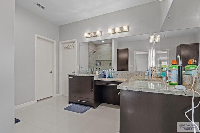 5483 Lovers Ln, Brownsville, TX 78526 - bathroom featuring a stall shower, vanity, and tile patterned flooring
