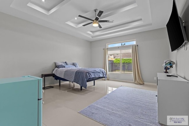 5483 Lovers Ln, Brownsville, TX 78526 - bedroom with a raised ceiling and ceiling fan