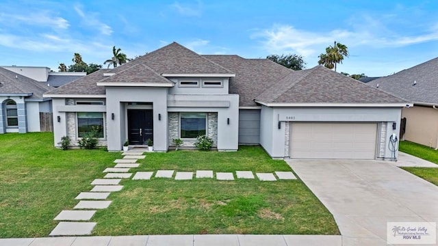 5483 Lovers Ln, Brownsville, TX 78526 - view of front of property with roof with shingles, stucco siding, and a front yard