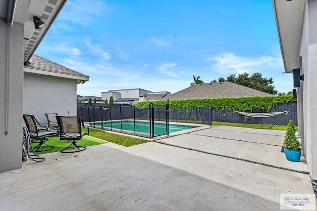5483 Lovers Ln, Brownsville, TX 78526 - fenced backyard with a patio area