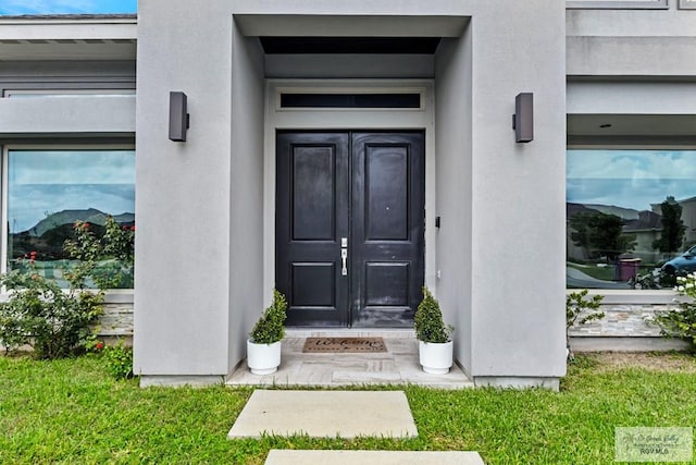 5483 Lovers Ln, Brownsville, TX 78526 - doorway to property with french doors and stucco siding