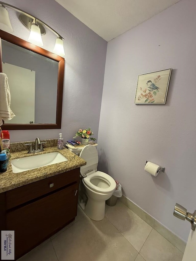 2100 W San Marcelo Blvd Unit 216, Brownsville, TX 78526 - half bath with tile patterned flooring, toilet, vanity, and baseboards