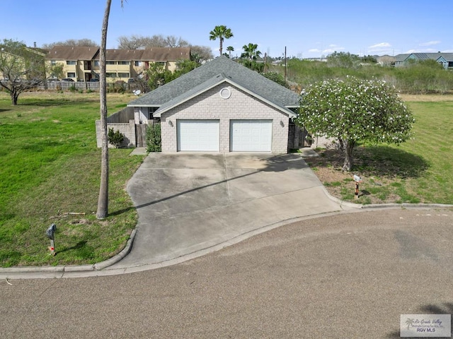 ranch-style home with a front lawn and a garage