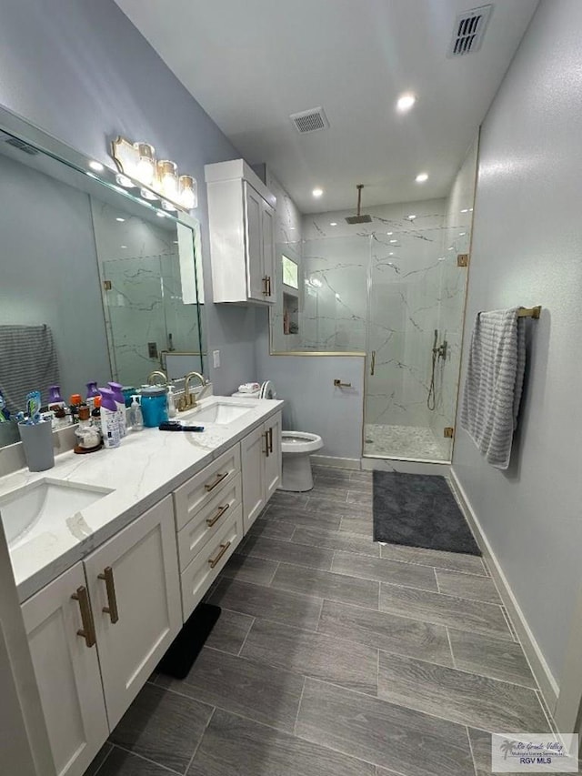 bathroom with vanity and an enclosed shower