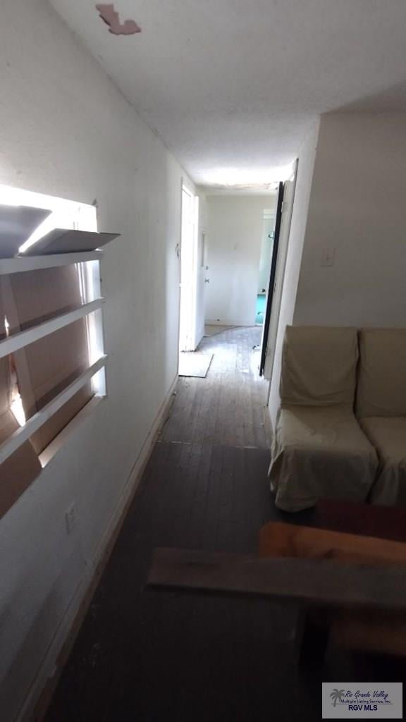 corridor featuring wood-type flooring