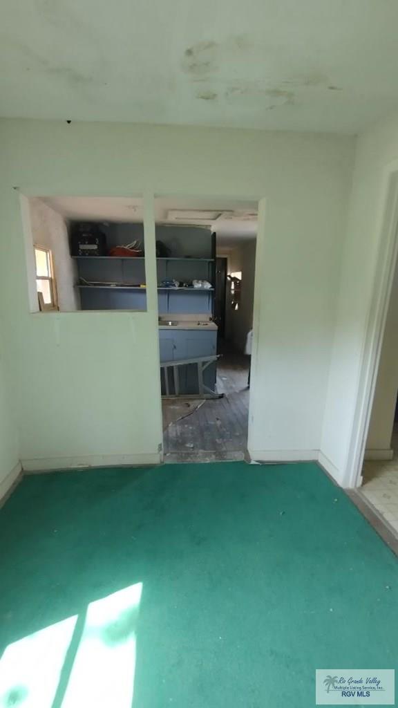 interior space featuring baseboards