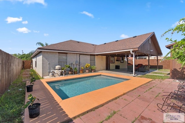 view of swimming pool featuring a patio area and an outdoor living space