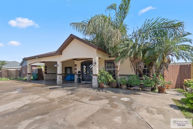 view of front of home with a carport