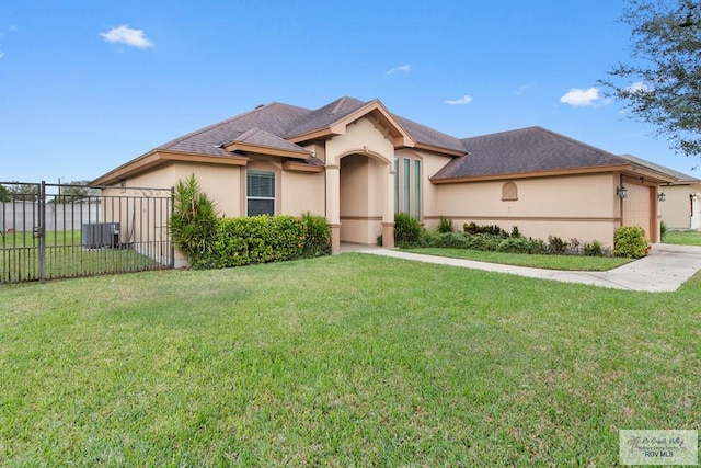 view of front of house with a front yard and a garage