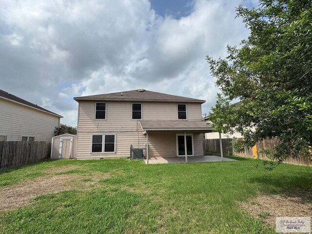 1072 Vamonos Dr, Brownsville, TX 78526 - rear view of property with a patio area, a storage unit, central AC, and an outdoor structure