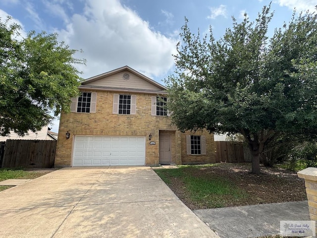 1072 Vamonos Dr, Brownsville, TX 78526 - traditional-style house featuring driveway, a garage, fence, and brick siding