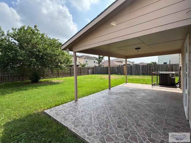 1072 Vamonos Dr, Brownsville, TX 78526 - view of patio / terrace featuring central AC