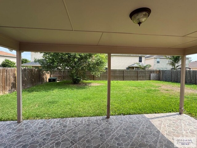 1072 Vamonos Dr, Brownsville, TX 78526 - view of yard with a patio