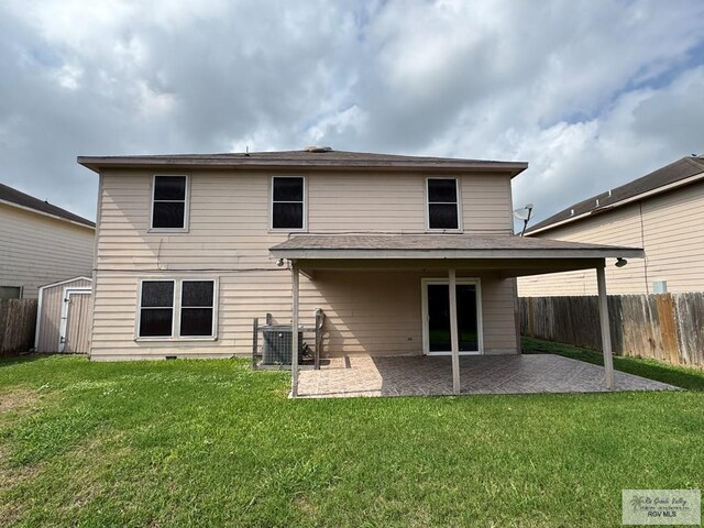 1072 Vamonos Dr, Brownsville, TX 78526 - rear view of house with a patio area, central AC, a shed, and an outbuilding