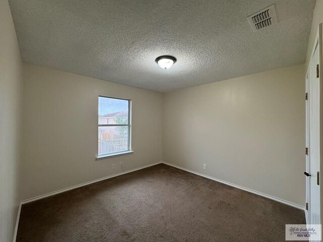 1072 Vamonos Dr, Brownsville, TX 78526 - spare room featuring carpet floors, a textured ceiling, and baseboards