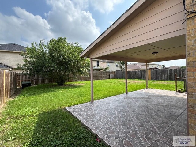 1072 Vamonos Dr, Brownsville, TX 78526 - view of yard featuring a patio area