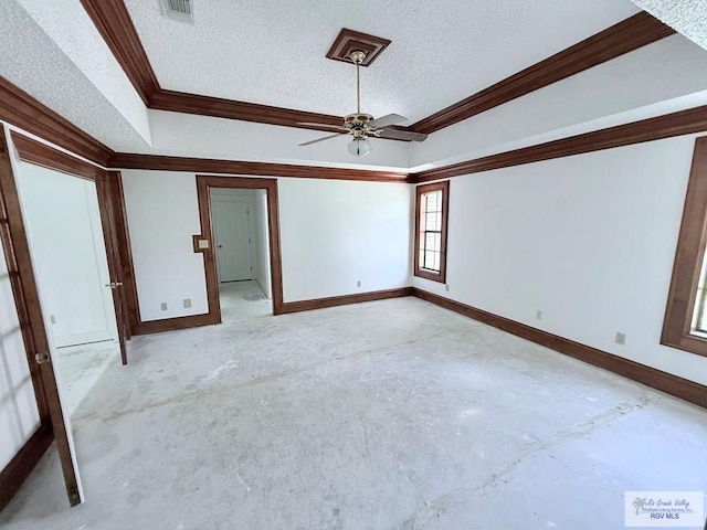 unfurnished room featuring ceiling fan, ornamental molding, and a textured ceiling