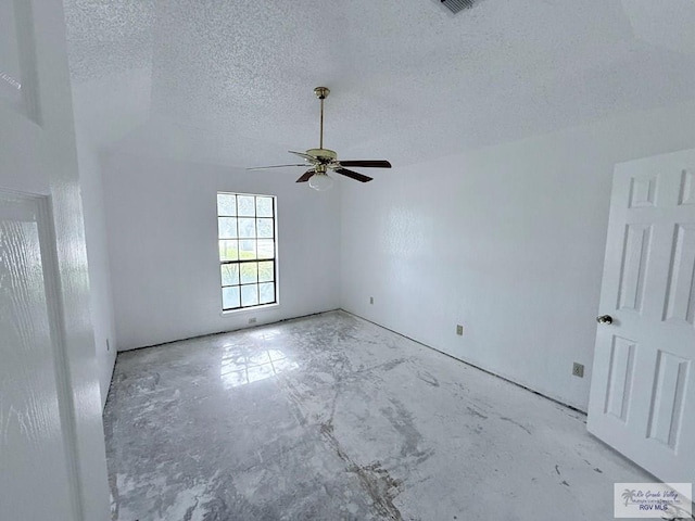 spare room featuring ceiling fan and a textured ceiling