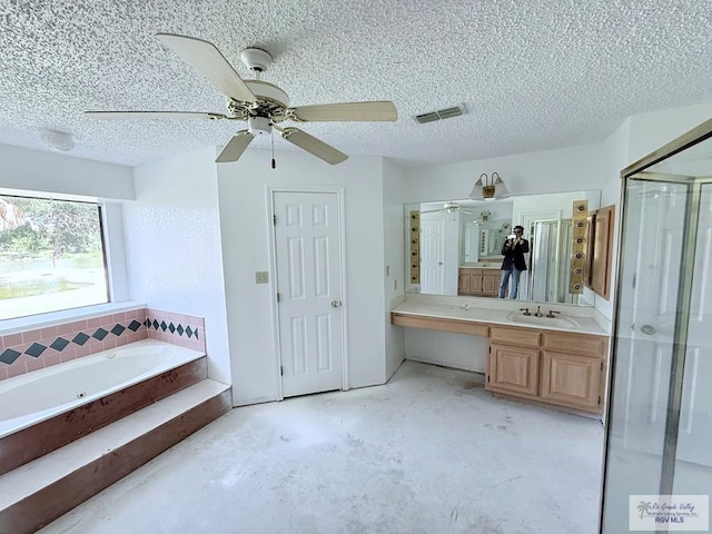 bathroom featuring vanity, a textured ceiling, plus walk in shower, and concrete floors