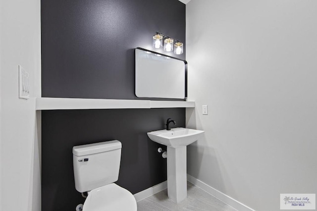 bathroom with toilet and sink