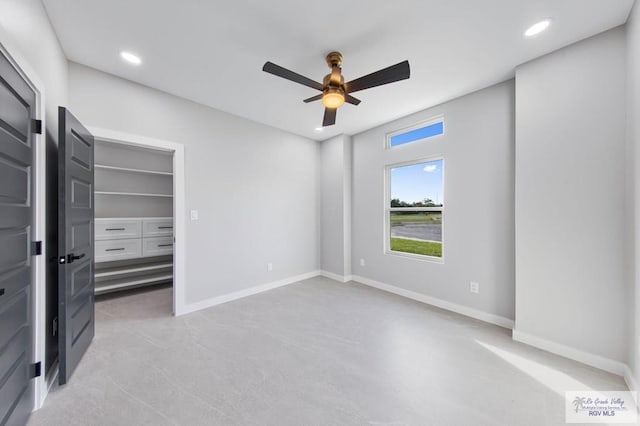 unfurnished bedroom featuring ceiling fan