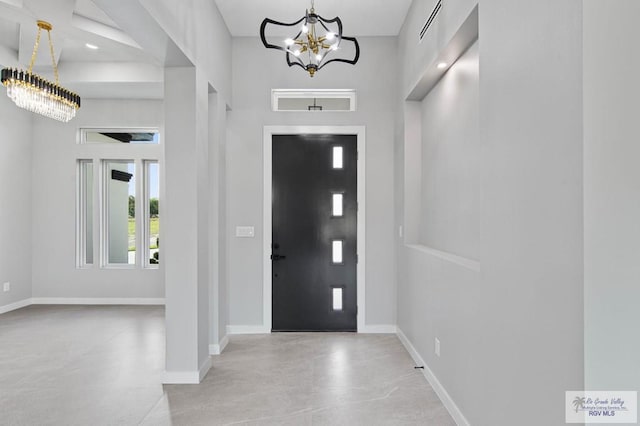 entryway featuring a chandelier