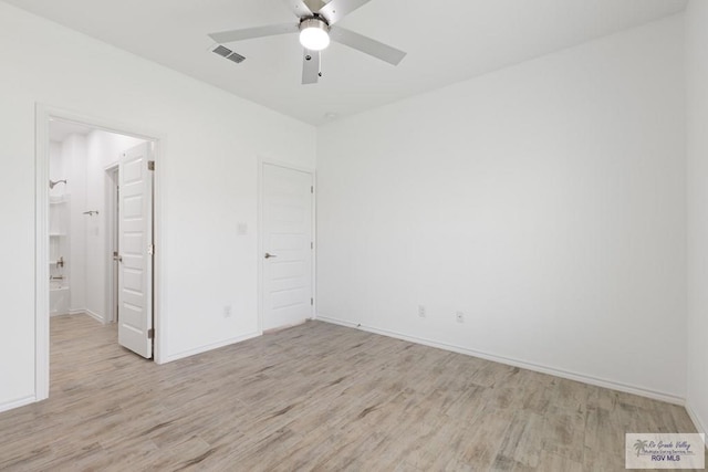 spare room featuring ceiling fan and light hardwood / wood-style floors