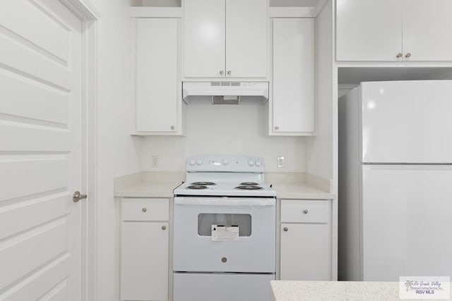 kitchen featuring white cabinetry and white appliances