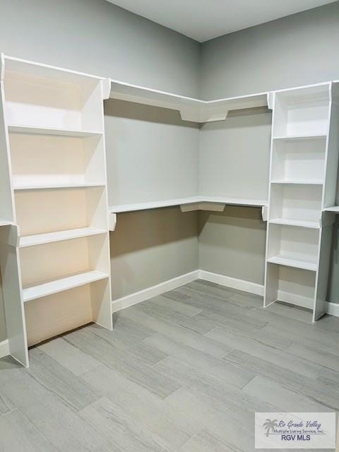 521 Valley Oak Cir, Los Fresnos, TX 78566 - spacious closet with wood finished floors