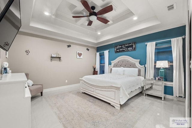 bedroom with ornamental molding, ceiling fan, and a tray ceiling