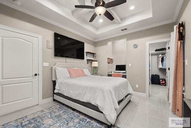 bedroom featuring light tile patterned flooring, a walk in closet, ornamental molding, and ceiling fan