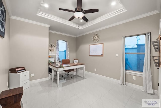 office area with ceiling fan, ornamental molding, and a raised ceiling