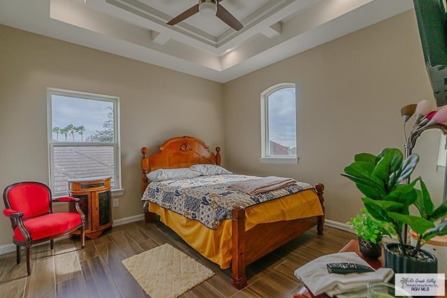 bedroom with coffered ceiling, dark wood-type flooring, and ceiling fan