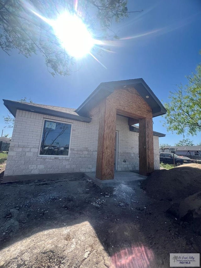 24824 Birch St Unit 12, San Benito, TX 78586 - view of home's exterior featuring brick siding