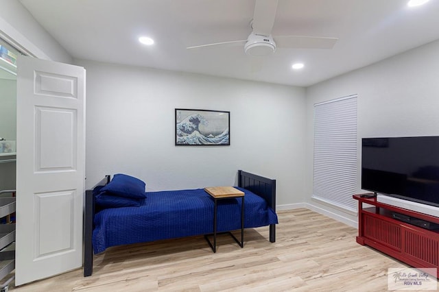 bedroom with light hardwood / wood-style floors and ceiling fan