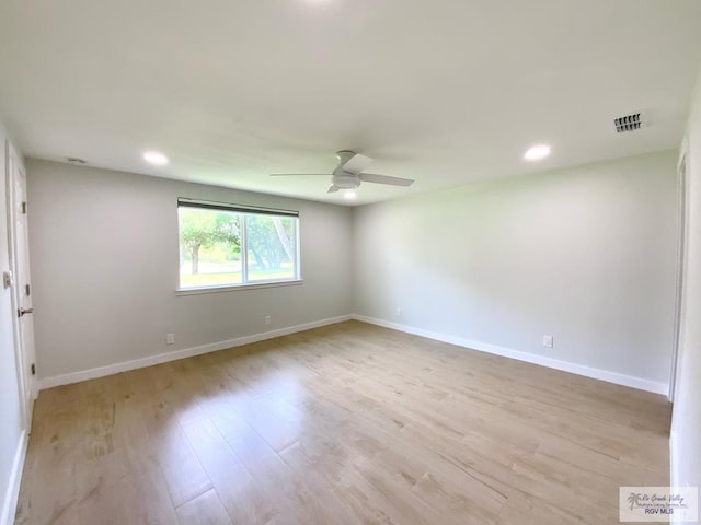 unfurnished room featuring visible vents, baseboards, ceiling fan, and light wood-type flooring