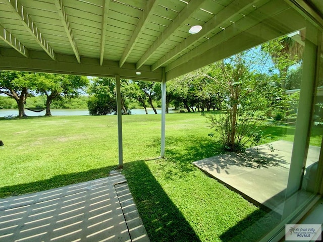 view of yard featuring a patio and a water view