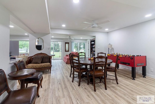 dining space featuring ceiling fan, light wood-type flooring, and a wealth of natural light