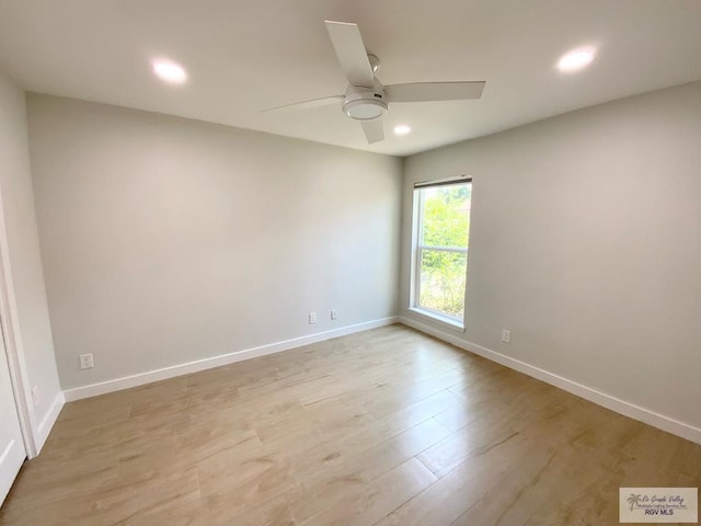 empty room featuring recessed lighting, a ceiling fan, and baseboards