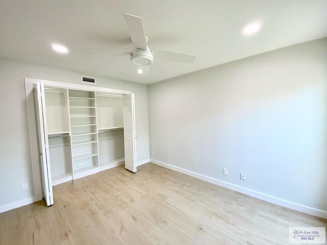 unfurnished bedroom featuring recessed lighting, baseboards, light wood-type flooring, visible vents, and a closet