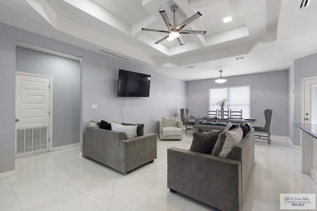9129 Lake Charles Dr, Los Fresnos, TX 78566 - living room with ceiling fan, a raised ceiling, coffered ceiling, and light marble finish flooring