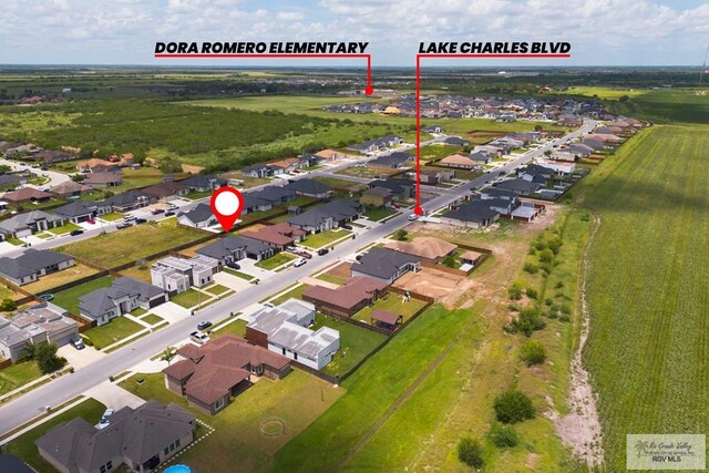 9129 Lake Charles Dr, Los Fresnos, TX 78566 - aerial view of property and surrounding area with nearby suburban area