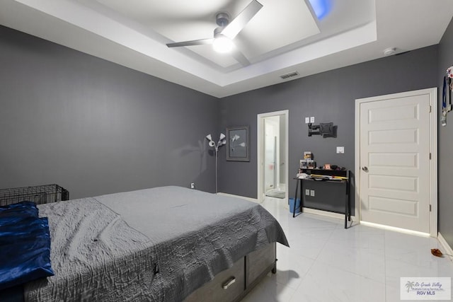 9129 Lake Charles Dr, Los Fresnos, TX 78566 - bedroom with a raised ceiling, ceiling fan, and light marble finish flooring