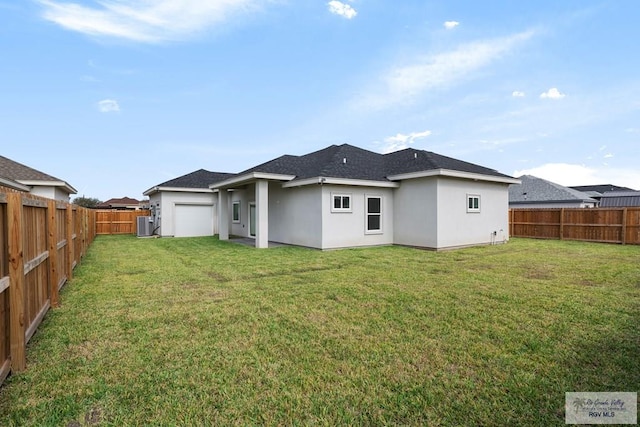 rear view of property featuring cooling unit and a yard