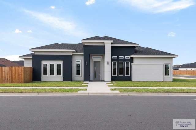 prairie-style home with a front lawn