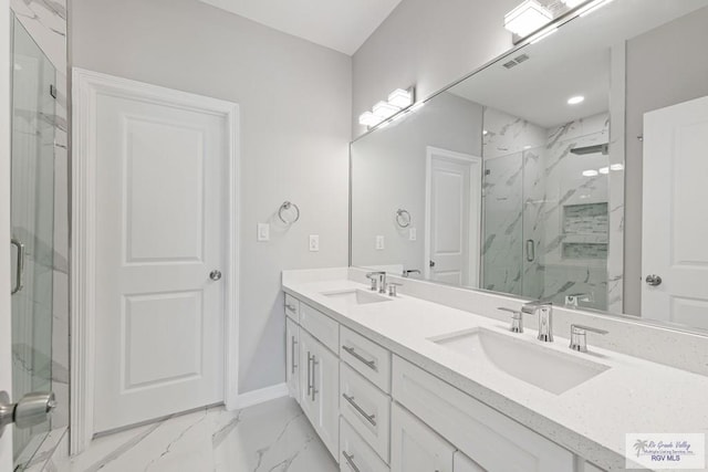 bathroom featuring vanity and an enclosed shower