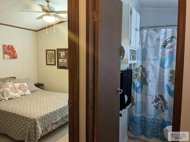 bedroom with ceiling fan and crown molding